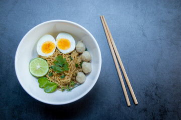 I eat instant noodles, boiled eggs and vegetables at the street food stalls most days.