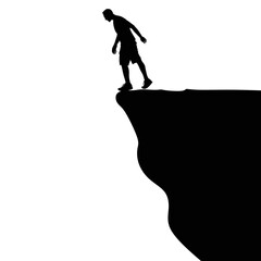 Silhouette of standing man on cliff