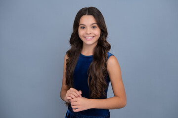 Cute preteen girl head shot. Child portrait on isolated background. Beautiful teenager face. Happy girl face, positive and smiling emotions.