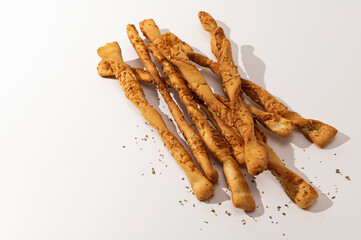 Grissini, bread sticks on a white background, place for text