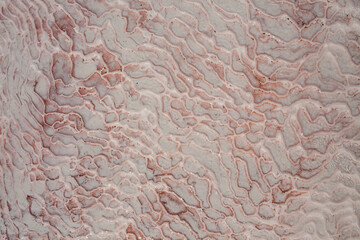 Limestone floor in Pamukkale calcium travertine in Turkey, asymmetric pattern close-up. White cotton castle texture. Red Calcium stone textured. Limestone