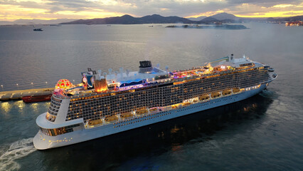 Aerial drone photo of huge illuminated cruise liner ship cruising to popular Aegean destinations at dusk with beautiful colours © aerial-drone