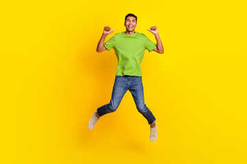 Fototapeta na wymiar Full size photo of overjoyed excited man jumping point fingers self himself isolated on yellow color background