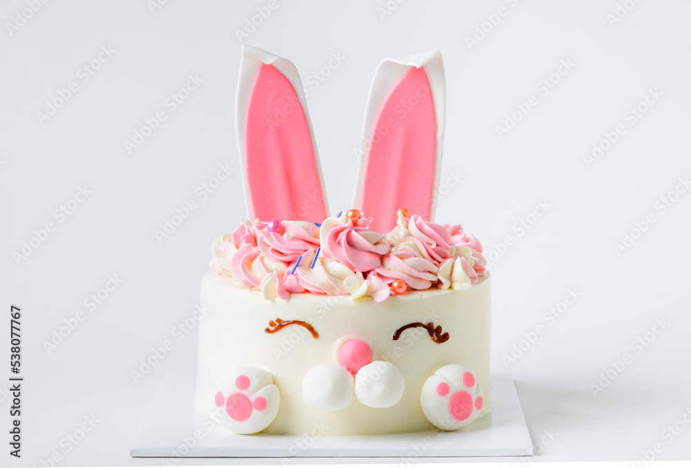 Wall mural Easter bunny celebration cake  on white background, homemade birthday cake