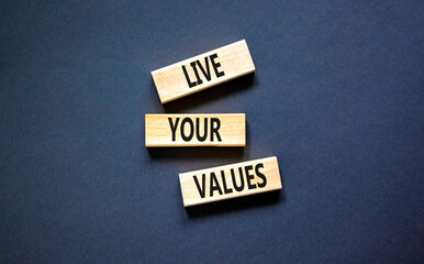 Live your values symbol. Concept words Live your values on wooden blocks. Beautiful grey table grey background. Business, psychological and live your values concept. Copy space.