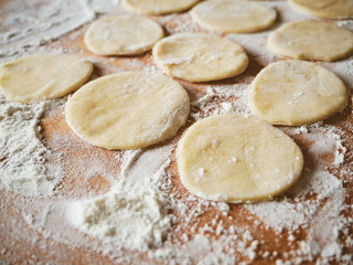 Fototapeta na wymiar Fresh ravioli handmade cooking on wooden desk. And ricotta ravioli.