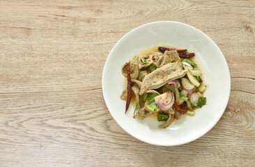 Thai spicy boiled slice pork liver with skin salad on plate