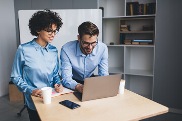 Fototapeta premium Millenial business man and woman working in office