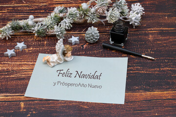 Christmas card with the Spanish text Feliz Navidad y Próspero Año Nuevo.