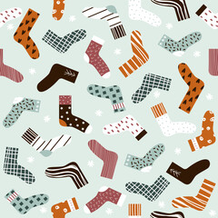 Seamless pattern with colorful socks. Winter print. Vector hand drawn illustration.