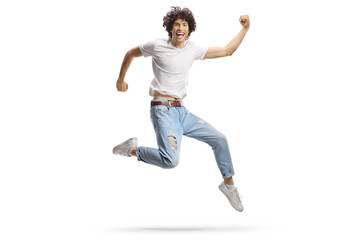 Casual young man jumping with happiness