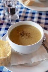 Traditional scottish vegetarian food, potato soup with leek, served in oldest gastro-pub of Edinburgh, Scotland