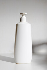 A large bottle for shampoo with a dispenser for mockups