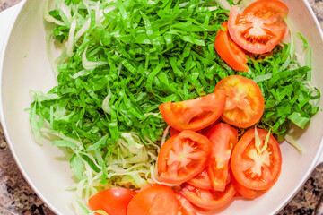 Vegetable and tomato salad. High quality healthy food photo. Typical Brazilian food for vegetarians