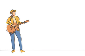 One continuous line drawing of young happy male guitarist wearing hat and playing acoustic guitar on street road. Trendy musician artist performance concept single line draw design vector illustration - obrazy, fototapety, plakaty