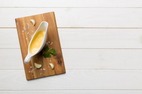 Gravy Boat With Tasty Cheese Sauce On Table Background. Top View