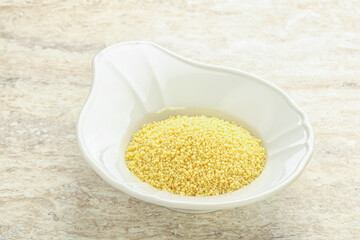 Raw couscous in the bowl