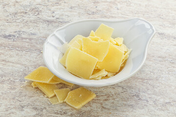 Sliced parmesan cheese heap in the bowl