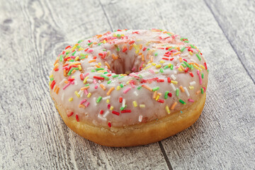 Sweet glazed vanilla donut with icing