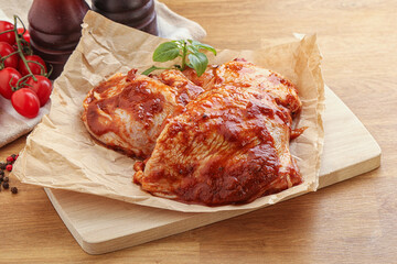 Marinated chicken leg in tomato sauce
