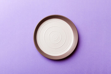 Top view of isolated of colored background empty round white plate for food. Empty dish with space for your design