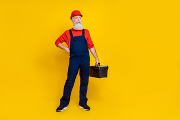 Full length photo of confident pensioner technician artisan look copyspace hold tool kit isolated...