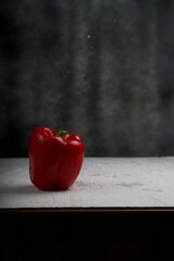 Red bell pepper isolated on white wooden board.Studio photoshoot.