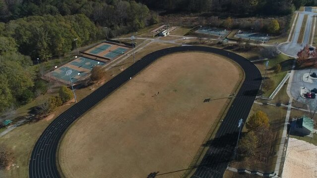 Aerial Top Half View Of Walking Track With Basketball Court