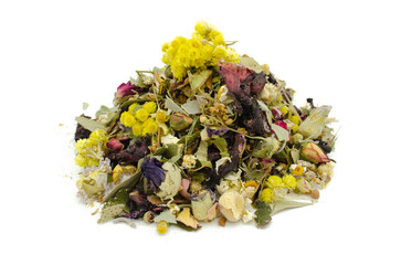 Dried mixed herbal tea top view on white background.