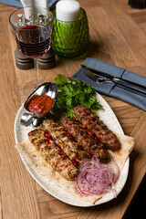 lula kebab on a plate in a restaurant