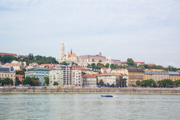 A stark view of the Fishermen's Bastion, the Church of St. Matthias, the Calvinist Church on the Danube Embankment in Budapest, Hungary