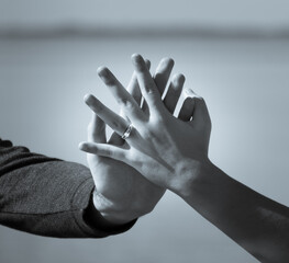 hands with engagement ring