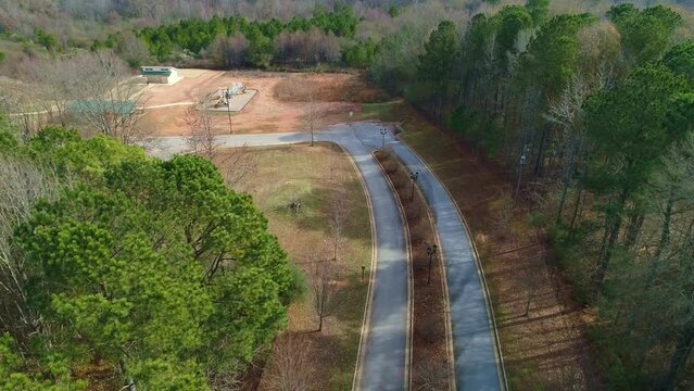 Aerial View Top Down Flying Over 2 Lane Streets In The Park