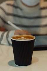 business woman with coffee in coffee shop background