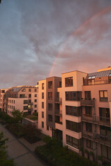 Concept of happy living in a modern house neighborhood and owning real estate. Contemporary resident complex in Europe during summer evenings.