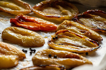 roasted bell pepper food healthy on baking tray, baked peppers, yellow and red pepperoni. Vegetable ingredients for healthy dinner or lunch. Seasoning peppers, autumn cousine