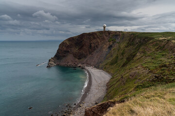 the cliffs at Hartland Point in Devon with the United Kindom RAF radar station perched on the...