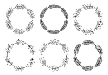 Doodle style winter decorative wreaths. Christmas botanical hand drawn design elements for invitations, greeting cards, blogs and prints.