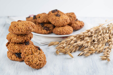 Oatmeal cookies and oatmeal spikelets on a light table.