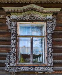 Old wooden window frame. folk art in detail close-up
