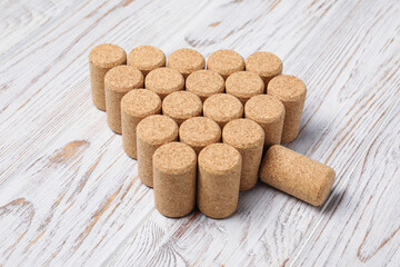 Christmas tree made of wine corks on white wooden table, above view