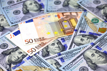US dollars and Euro banknotes. American and european economy, exchange rate