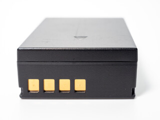 Battery for the camera on a white background.