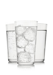 Still and sparkling mineral water with bubbles and ice on white background.