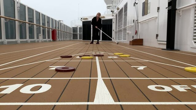 Playing Shuffleboard on a Cruise Ship