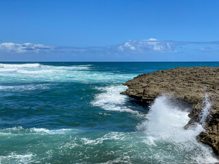 Waves breaking over rocks at Islote Sancho, Riviere Des Galets, Mauritius
