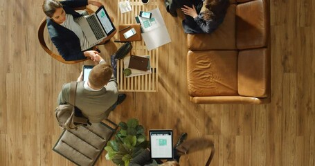 Startup company, business people and team in meeting for marketing, advertising and proposal for development strategy. Top view, collaboration and corporate group talking and working using technology