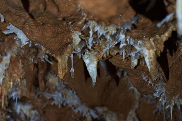 Crystals on speleothemes in a cave