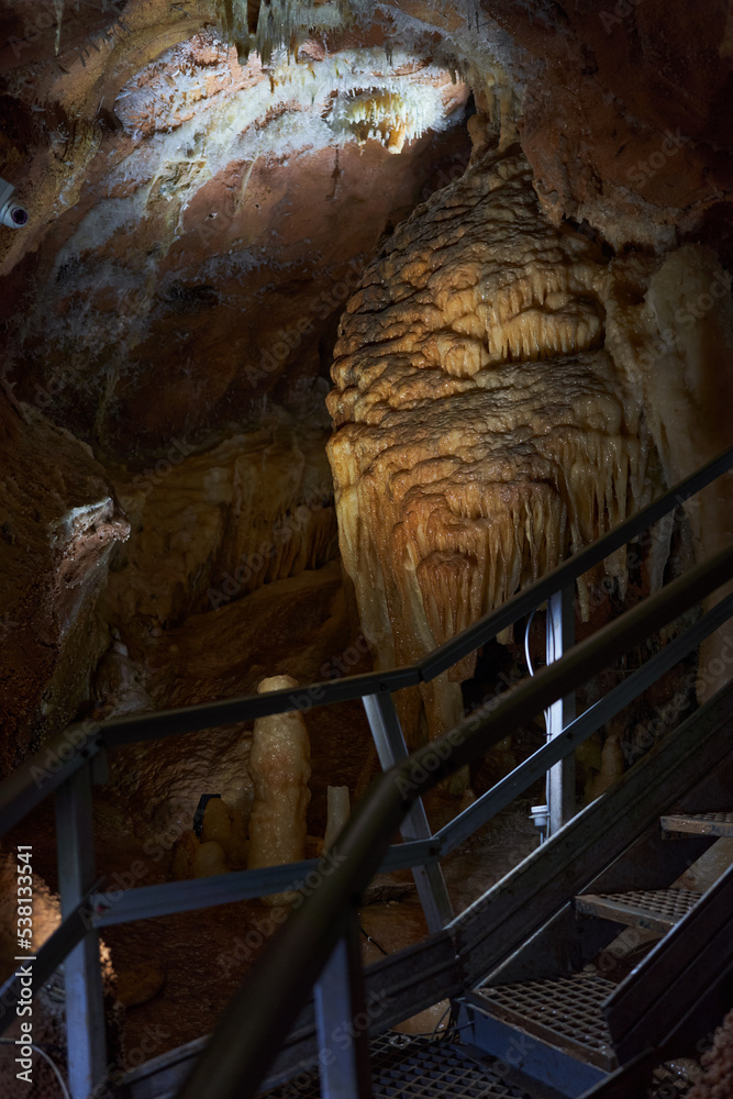 Wall mural crystals on speleothemes in a cave