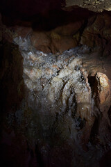 Crystals on speleothemes in a cave